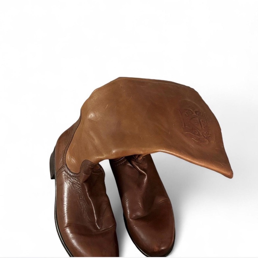 woman’s brown leather riding boots